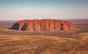 Explain Huge Australian landmark (5) using the Crossword Dictionary at