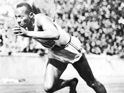 American track and field athlete who won four gold medals at the 1936 Olympic Games and is considered one of the greatest athletes ever: 2 wds. - wordplays.com