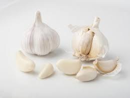 Segment of a bulb of garlic; an old weight for cheese or wool; or, from the French meaning "nail", a flower bud of a Moluccan or Zanzibari tree, dried as an aromatic spice (5) - wordplays.com