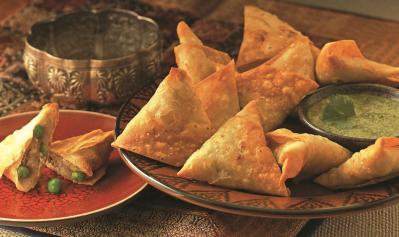 Explain In Indian cookery, a small triangular pastry case ...
