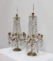 Explain Candelabrum with pendants of cut glass; a chandelier ...